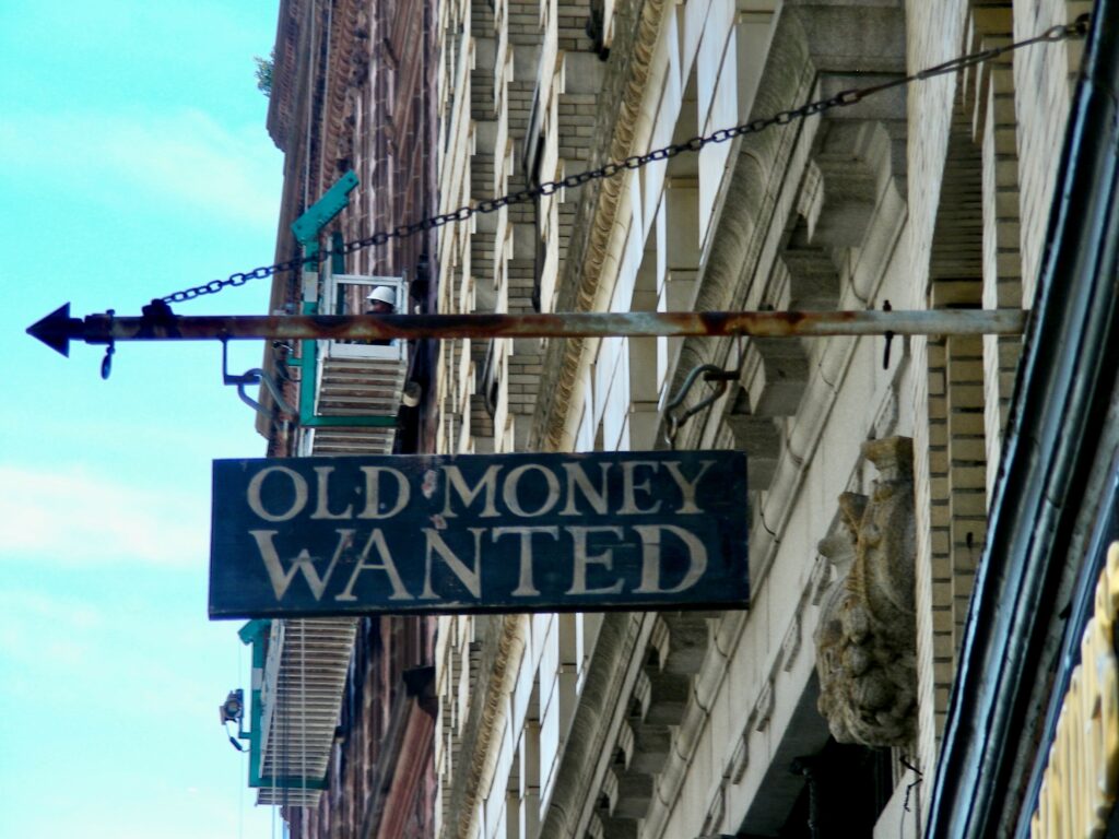 This is a photo of a Boston street sign that says, "Old Money Wanted."