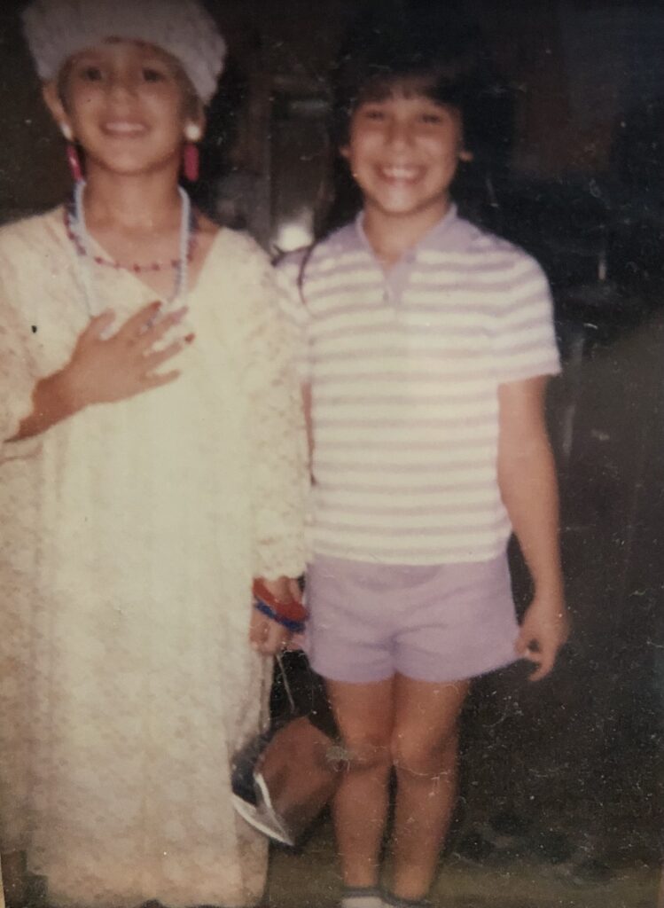 This is Kat and her brother when they were kids. Kat dressed up her brother in a gown, earrings, necklace, fake nails, a hat, and of course a purse! Later in life, Kat would discover a vegan hobo bag and other vegan options!