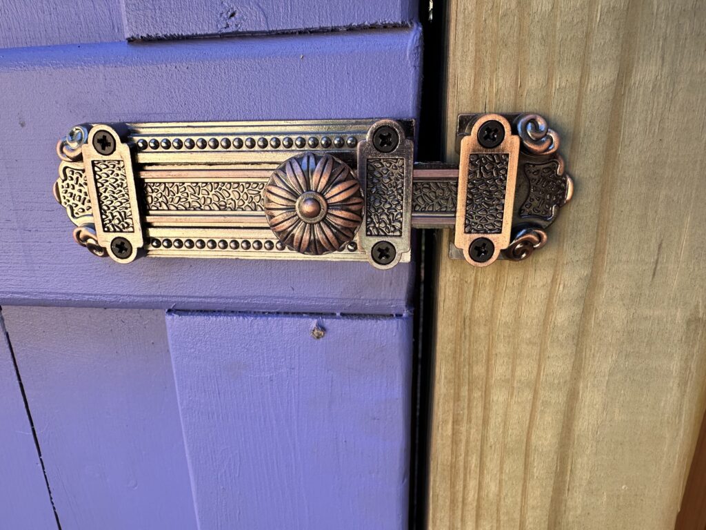 This is a photo of the fancy door latch on the secret garden door.