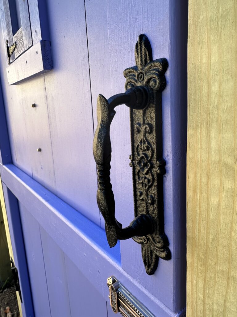 This is a photo of the fancy handle on the secret garden door.