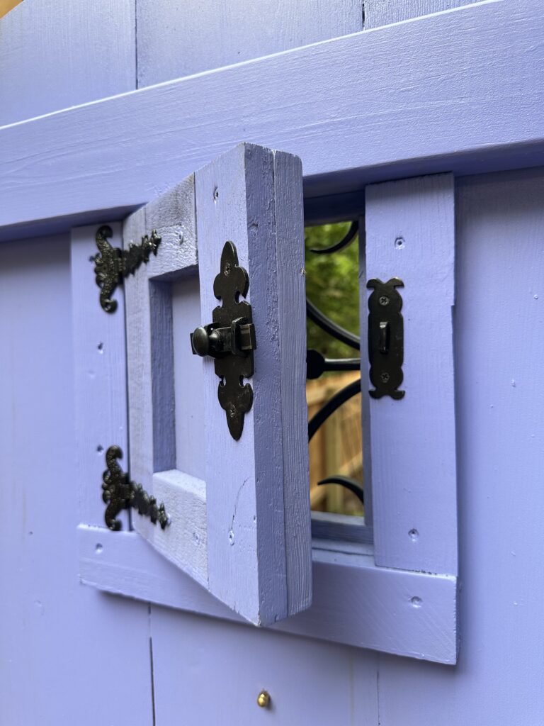 This is a picture of Kat's speakeasy door slightly opened as an example of cosy garden ideas.