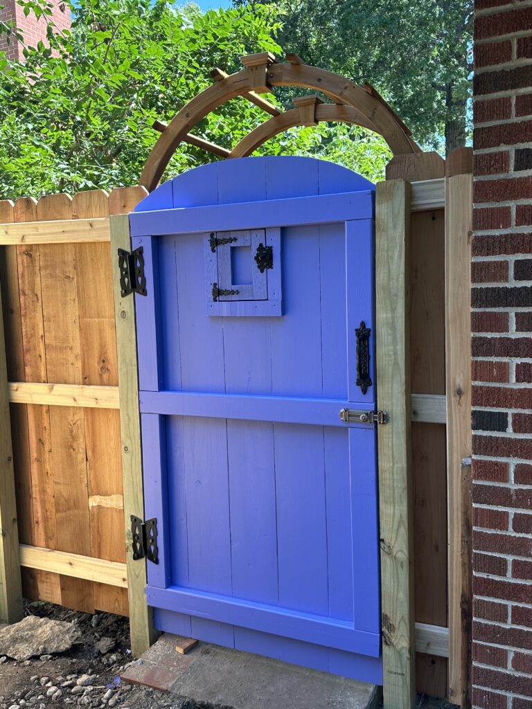 Kat's secret garden door with the rose arbor as an example of how to make a secret garden.