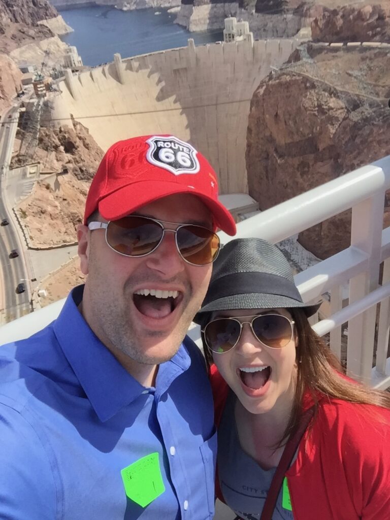 This is Kat and her brother at a dam as a funny example of travel precautions to bring your brother at your own risk!