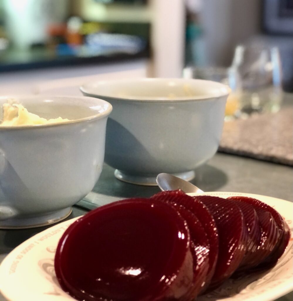 A photo of how to thanksgiving by placing canned cranberry sauce on a fancy platter.