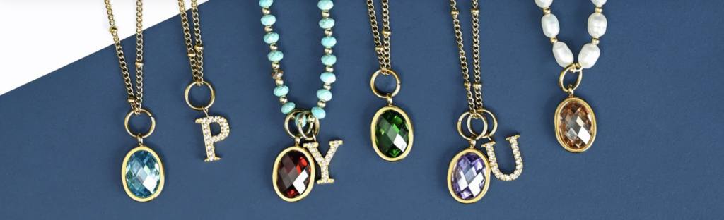 These are birthstone and initial necklaces from Starfish Project that represent sustainable holiday gifts.