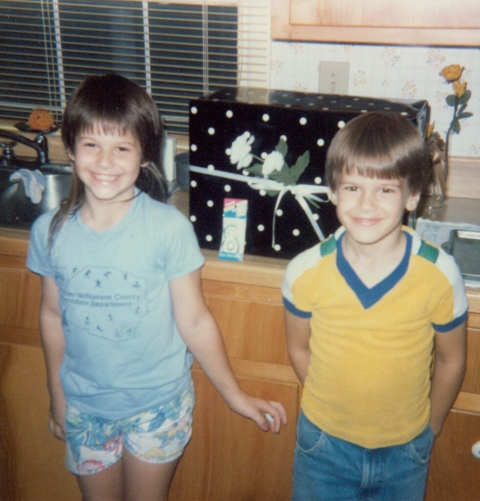 This is a photo of Kat and her brother when they were kids to demonstrate thanksgiving with the family.