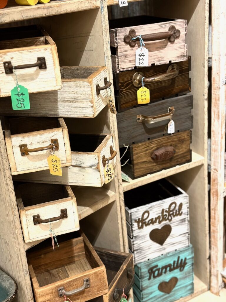 These are repurposed wooden drawers as unique christmas container ideas.