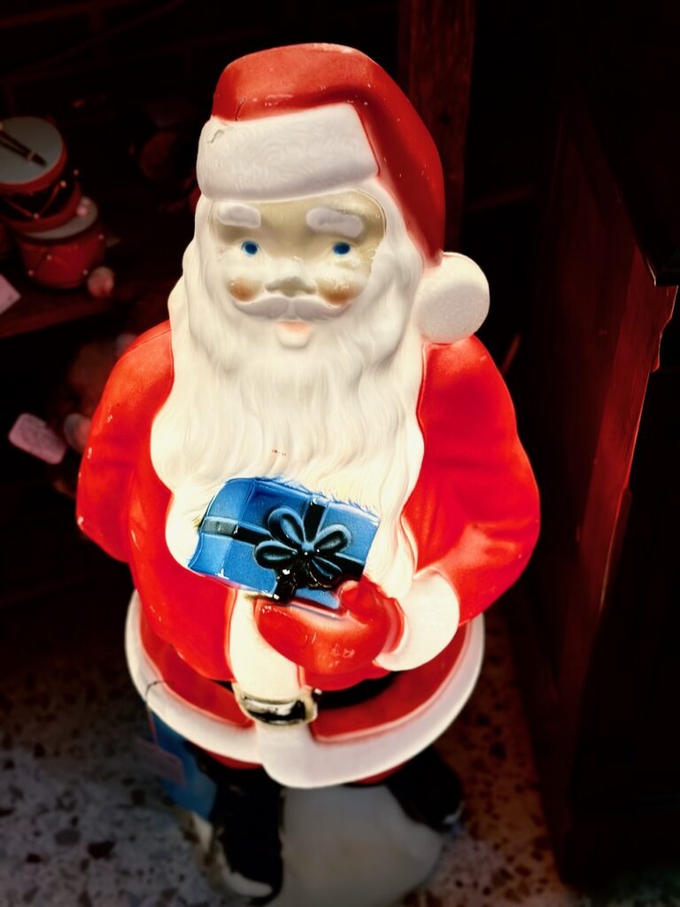 This is a vintage Santa statue that lights up as an example of old world santa figurines.