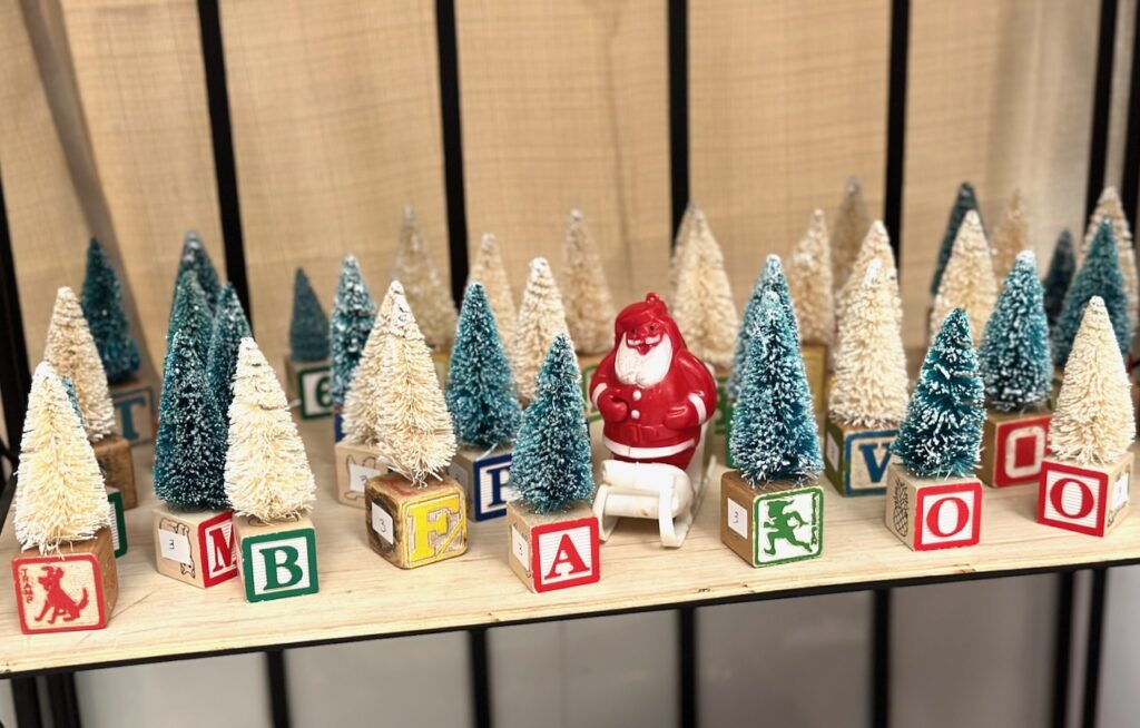 These are vintage building blocks with bottle brush trees to show wood christmas market decorations.