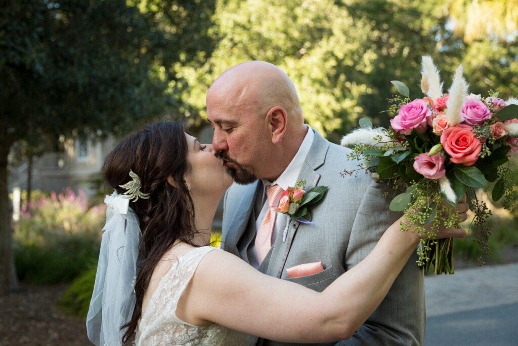 This is Kat and Jon embracing and showing a vintage hair comb to show eco friendly wedding rings and jewelry.