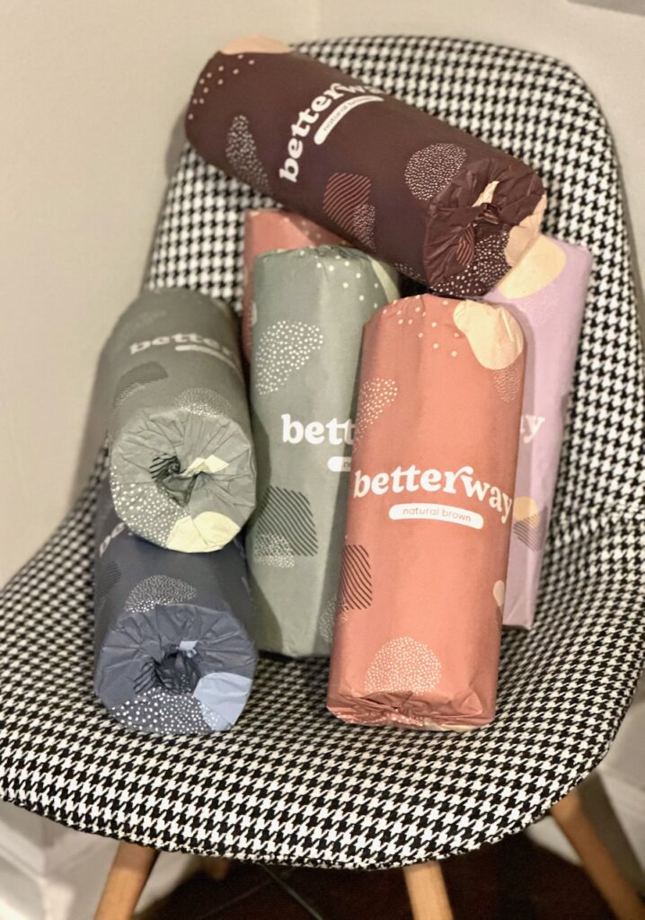 These are a bunch of rolls of Betterway bamboo paper towels in a black and white houndstooth desk chair to show low buy year rules.