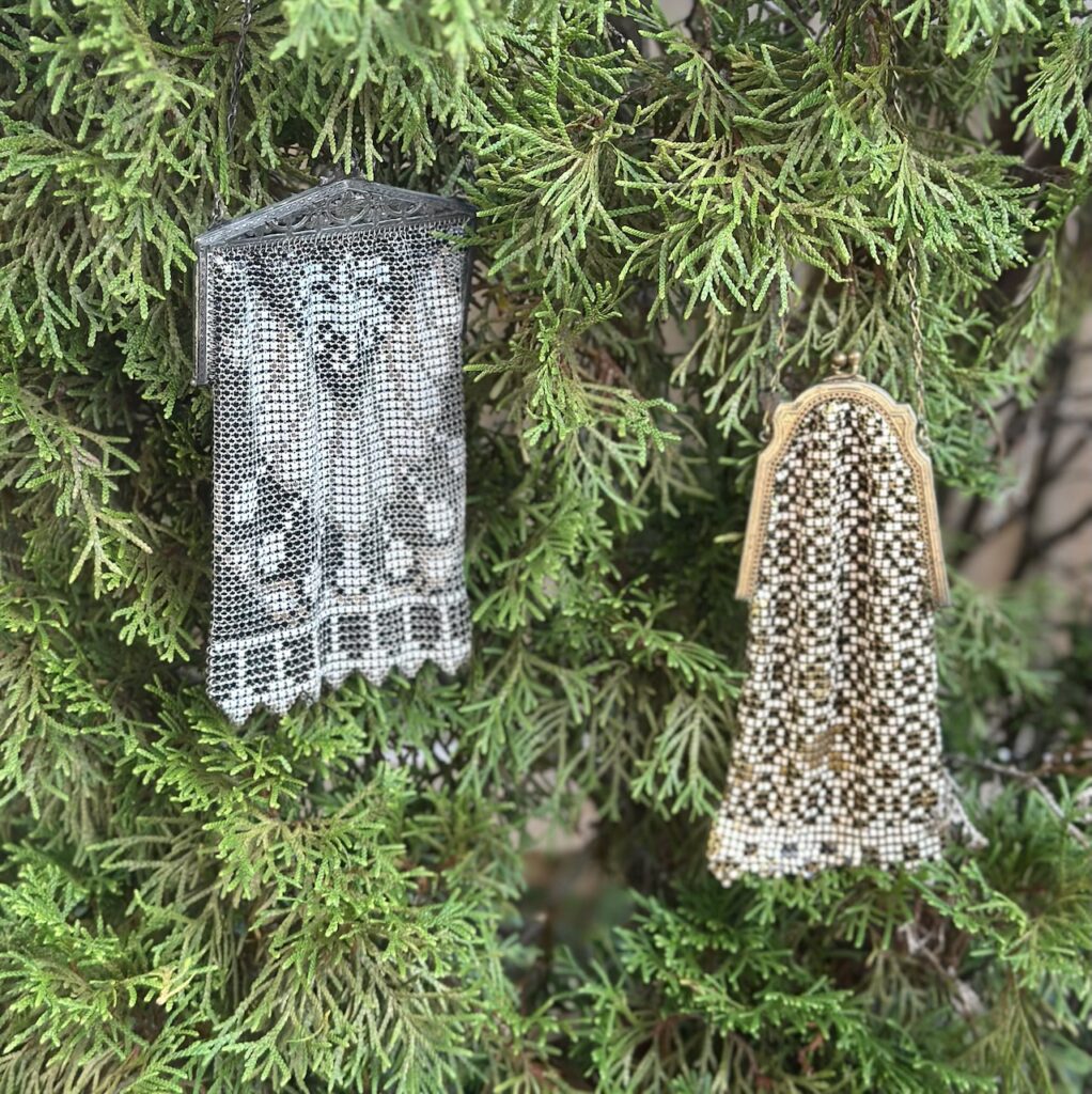 These are 1920s Art Deco flapper purses hanging on the Christmas tree to show plastic free christmas decorations.