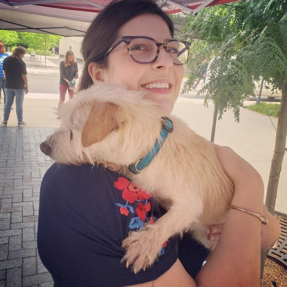 This is Kat holding a cute rescue dog to show 5 ways to show kindness to animals.